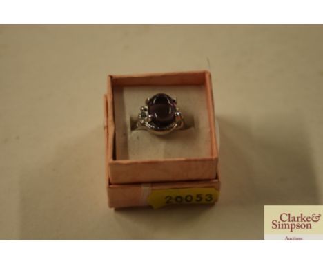 A white metal and amethyst set dress ring