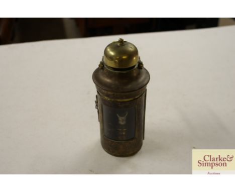 A ship's brass and copper storm lamp