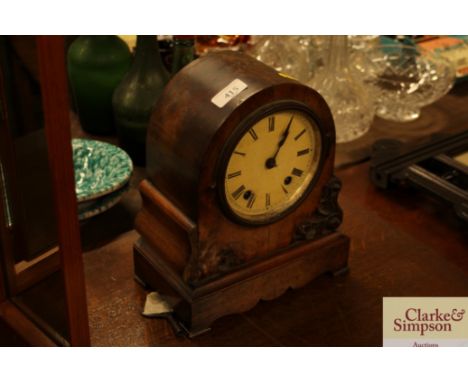 A Victorian walnut mantel clock 