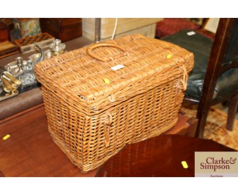 A wicker basket and contents to include a vintage Duo Ensign camera, a wooden planter etc.