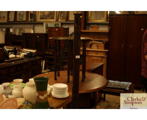 An Oriental carved hardwood standard lamp