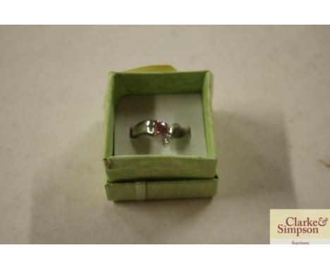 A boxed 925 pink stone set dress ring