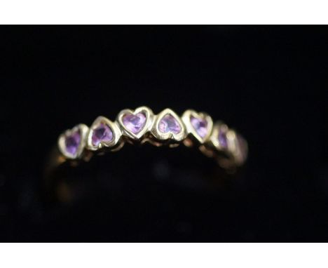 9ct Gold dress ring, set with 7 pink heart shaped stones Size R