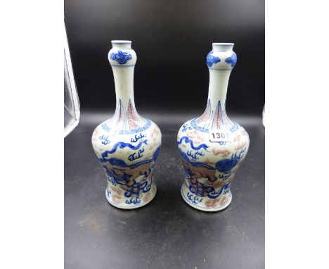 A PAIR OF CHINESE MALLET SHAPE VASES WITH FOO LION AND CLOUD DECORATION, DOUBLE RING MARK TO BASE.   H.25cms.