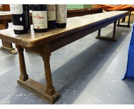 AN ANTIQUE COUNTRY PINE LONG FORM OR BENCH ON TURNED SUPPORTS.   L.340 x W.30 x H.44cms.