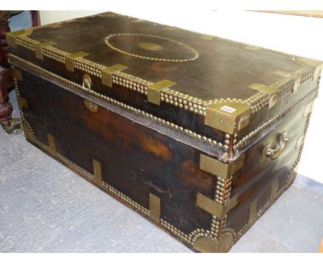 A 19th.C.LEATHER BOUND AND BRASS MOUNTED CAMPHORWOOD CAMPAIGN TRUNK WITH NAME PLATE HENRY STONE, ESQ.  No.3.   W.107 x H.51 x