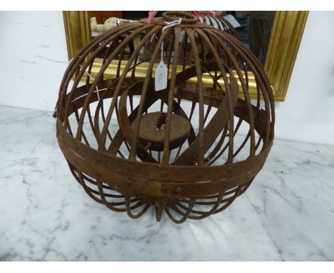 A WROUGHT IRON GIMBLE BALL OIL LAMP.
