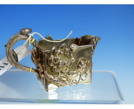 AN ORIENTAL WHITE METAL CREAM JUG IN THE ART NOUVEAU MANNER WITH RELIEF LEAF AND FOLIATE DECORATION, CHARACTER SIGNED TO BASE