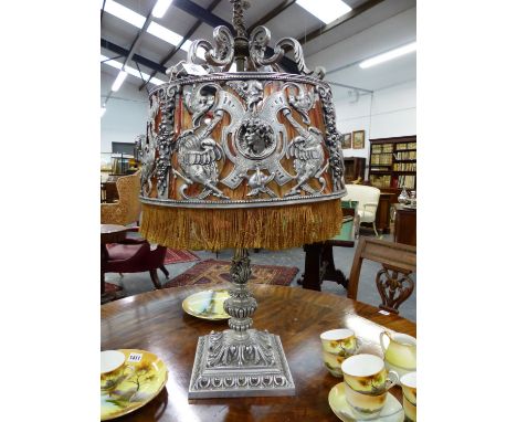 AN INTERESTING CAST METAL FOUR LIGHT TABLE LAMP WITH METAL SQUARE SUPPORTS DECORATED WITH DRAGONS AND SWAGS OF FRUIT.   H.OVE