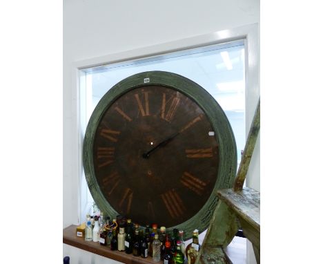 A LARGE COPPER CLOCK DIAL IN PAINTED SURROUND.   Dia.90cms OVERALL.