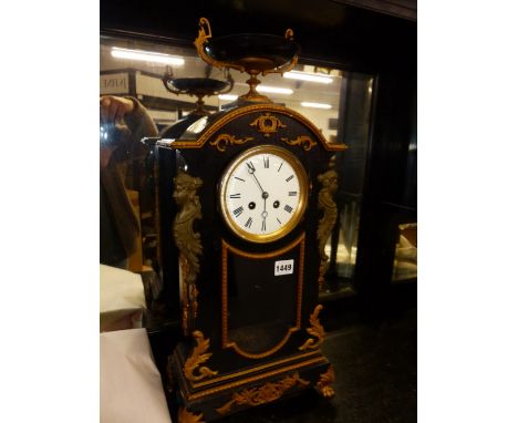 A 19th.C.FRENCH EBONISED AND GILT METAL MOUNTED MANTLE CLOCK WITH URN SURMOUNT, 8-DAY MOVEMENT AND GONG STRIKE.   H.59cms.