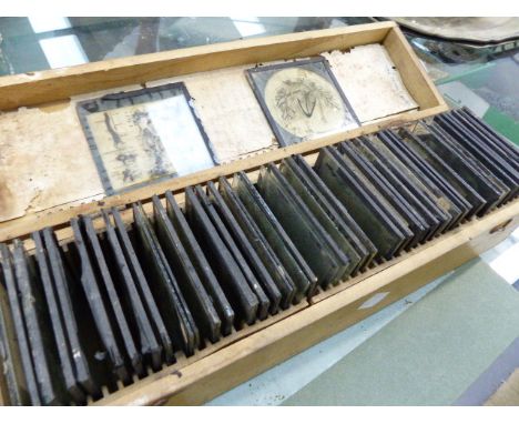 A BOX OF VINTAGE MAGIC LANTERN ANATOMICAL SLIDES