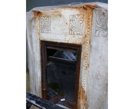 AN ART NOUVEAU CAST IRON FIRE SURROUND AND INSERT.