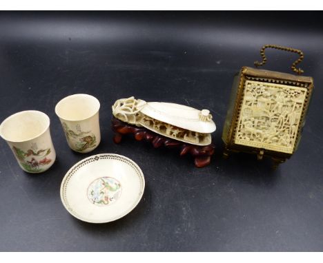 ORIENTAL CARVED  IVORIES TO INCLUDE TWO TALL CUPS, ONE SAUCER, A CARVING OF THE CLAM'S DREAM AND A PANEL SET INTO A FRENCH GI