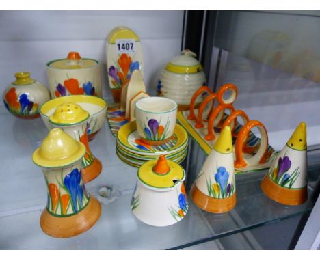 NEWPORT AND WILKINSON POTTERIES CLARICE CLIFF BIZARRE CROCUS PATTERN.   A COLLECTION OF CONDIMENTS, TWO TOAST RACKS, A SMALL 