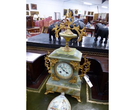 A LATE VICTORIAN GREEN ONYX CASED MANTLE CLOCK WITH PAINTED ENAMEL DIAL AND FRENCH BELL STRIKE MOVEMENT.