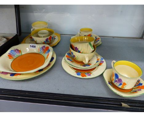 NEWPORT AND WILKINSON POTTERIES CLARICE CLIFF BIZARRE CROCUS PATTERN. A COLLECTION OF VARIOUS TEA CUPS, SAUCERS AND SIDE PLAT