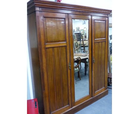 A VICTORIAN AMERICAN WALNUT FRAMED MIRROR DOOR WARDROBE, THE INTERIOR FITTED WITH FOUR DRAWERS AND SLIDING SHELF.   W.189cms.