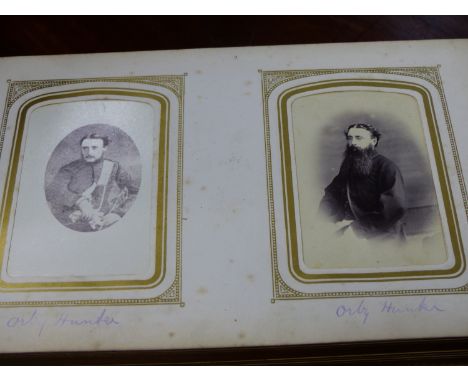 A VICTORIAN FAMILY PORTRAIT PHOTO ALBUM WITH BRASS CLASP.