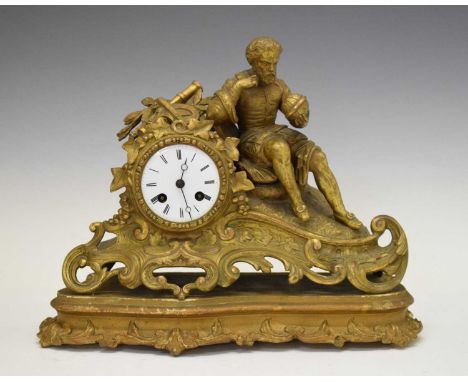 French gilt spelter mantel clock, with white Roman dial and two train movement striking on a bell, the case surmounted by a f