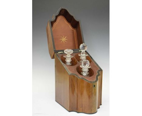 George III mahogany serpentine-front knife box converted into a decanter holder with three glass decanters, 37cm high