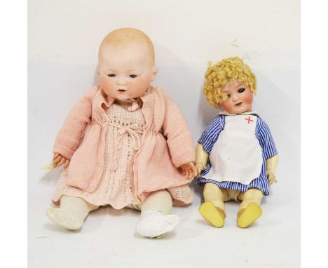 Two early 20th Century German bisque head dolls, comprising a Heubach Koppelsdorf example, with sleeping blue glass eyes and 