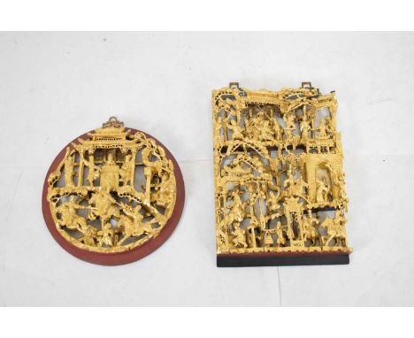 Chinese carved and gilded softwood rectangular panel, worked in relief with priests in a temple flanked by trees over a proce
