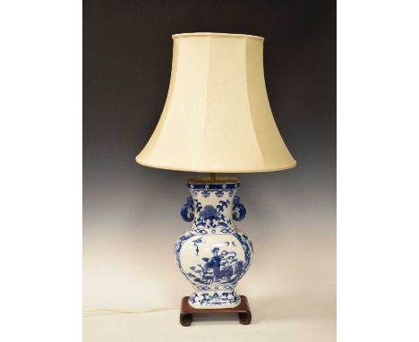 Chinese blue and white porcelain lamp with silk shade on hardwood stand, 81cm high