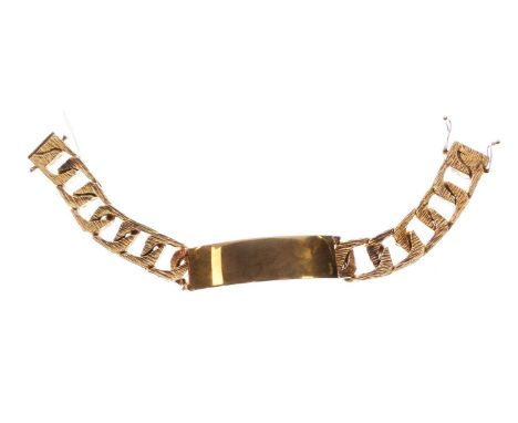9ct gold identity bracelet with textured links and plain ID panel, London 1979, 20cm long approx, 84.5g gross