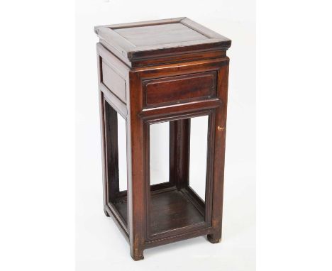 Chinese hardwood two-tier stand, the square top over fielded panel frieze, raised on square section supports united by lower 