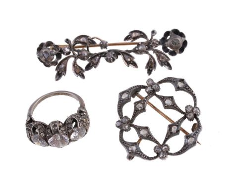 A three stone white paste ring, set with three circular cut white paste, finger size J; and two early 20th century diamond se