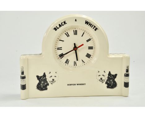 A Black and White Scotch Whisky Clock. In good working order. 