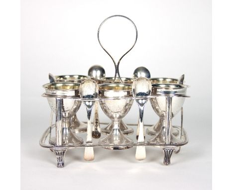 A George III silver egg cup stand and six egg cups, Peter & William Bateman, London 1813, the rounded rectangular frame with 