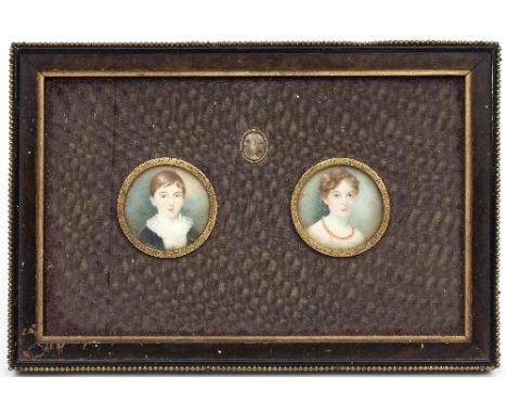A pair of 19th Century portrait miniatures/A Young Boy and A Young Girl/each in circular gilt metal mounts, framed as one, wi