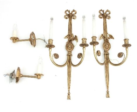 A pair of two-branch brass wall lights with ribbon-tie and eagle mounts, 70cm high and another pair of single light wall ligh