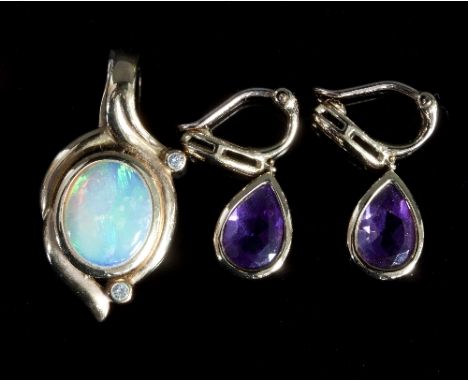 A 9ct gold, opal and diamond pendant with hinged clasp and a pair of 9ct gold amethyst set drop earrings