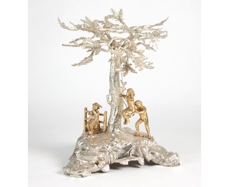 A silver table centrepiece, Asprey & Co Ltd, London 1968, modelled as a tree with three children in silver gilt playing benea