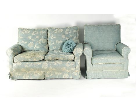 A modern two-seater sofa, 140cm wide and a similar armchair   Condition Report:  Lot 744Seat cushions badly stained.Upholster