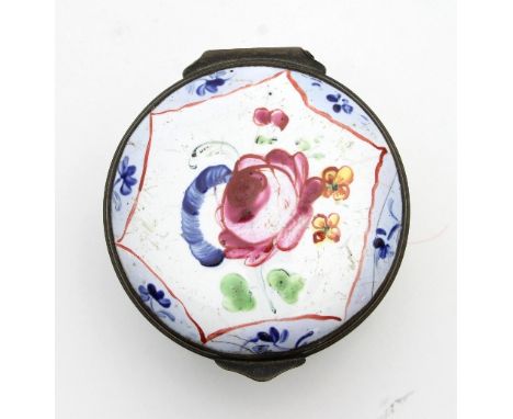 A Bilston enamel box, the circular top decorated flowers within a hexagonal reserve, the sides with floral sprays on a white 