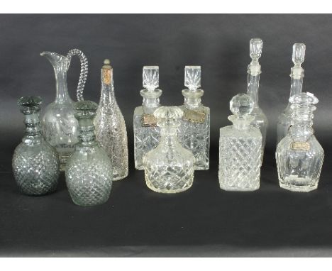 A pair of Victorian style glass decanters with globular pineapple cut bodies, another pair of decanters, a near pair of decan