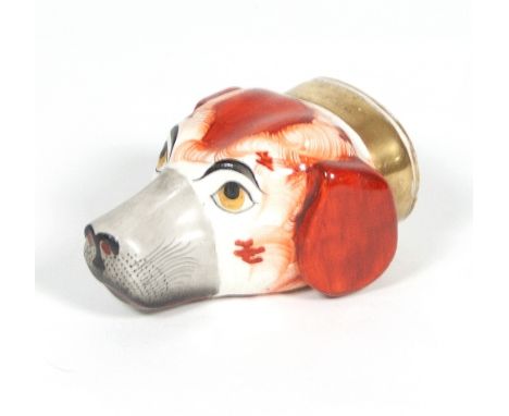 An English porcelain hound head stirrup cup, circa 1840, painted with a gilt collar, 10cm long   Condition Report:  73:Light 