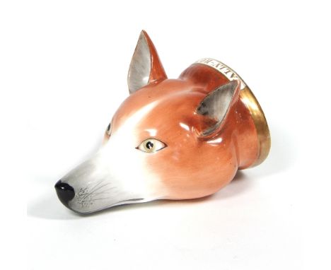 An English porcelain fox head stirrup cup, circa 1820, inscribed 'Tally Ho' to a gilt painted collar, 11cm long   Condition R