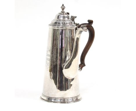 A Queen Anne Britannia standard silver chocolate pot, marks rubbed, the domed cover with hinged finial and scroll thumbpiece,
