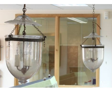 A pair of glass temple pendant lanterns, the rose with folded rim, each fitted three lights, 60cm deep   Condition Report:  L