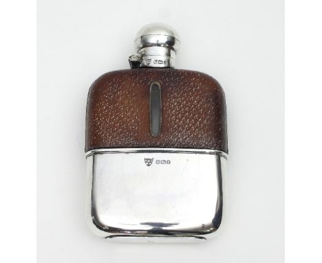 A silver mounted hip flask, Sheffield 1909, with pull-off cup and half leather covered