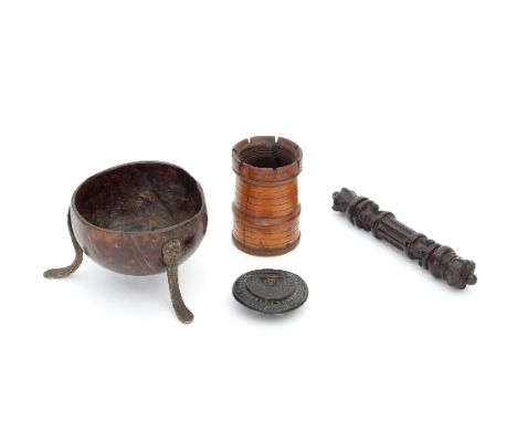 An 18th Century carved coconut snuff box, of circular form with floral carved hinged top, a carved wooden turret box (lacking