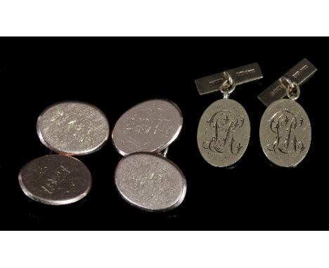 A pair of 9ct gold cufflinks, each with monogram to oval face with engine turned back bar, approximately 7gm, and a pair of 1