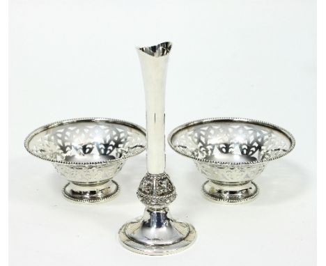 An Irish silver bud vase, Dublin 1974, of slender form with Celtic design knop on a circular foot, 14.5cm high and a pair of 