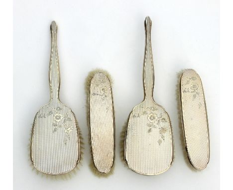 A pair of silver-backed hair brushes and a pair of clothes brushes, Adie Bros Ltd, Birmingham 1956/7, with engine turned deco