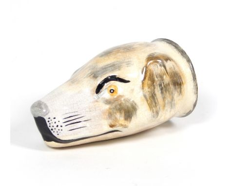 A 19th Century English earthenware hound head stirrup cup, painted in browns, yellows and black, 12.5cm long/see illustration
